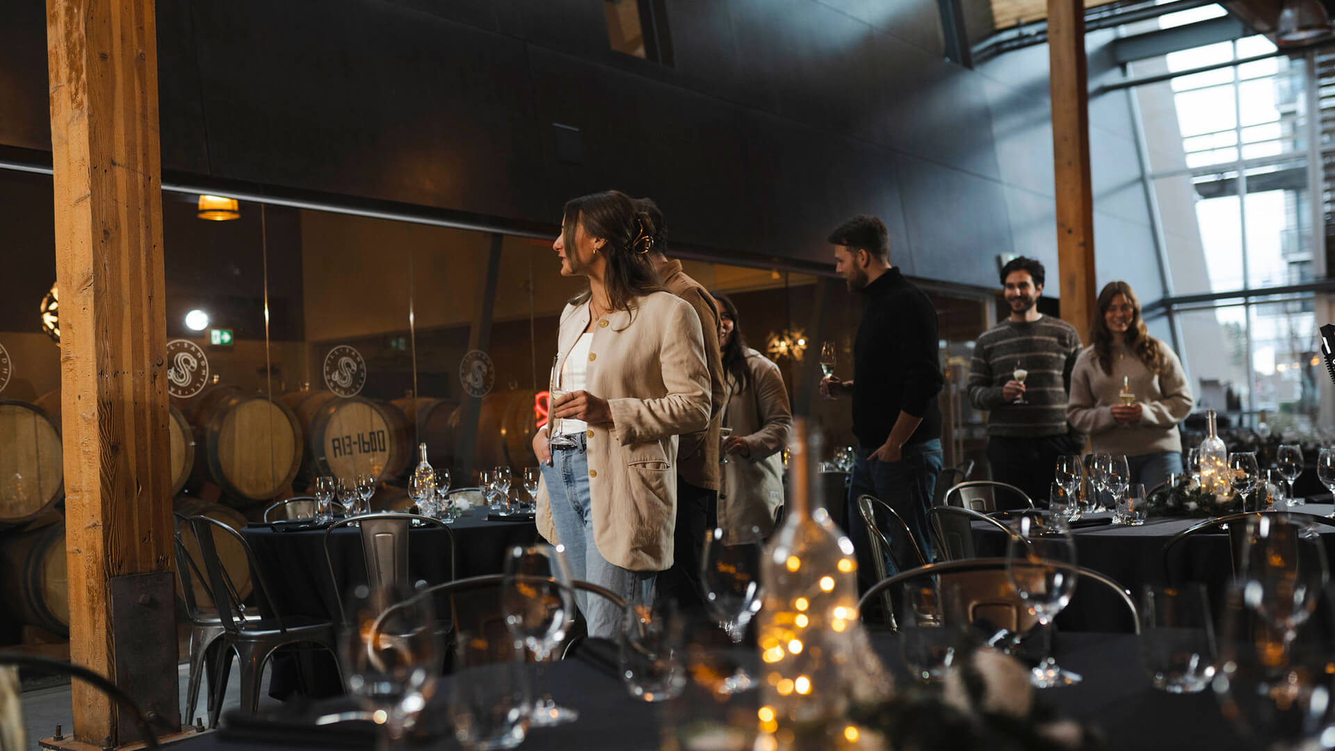 Sandhill Winery interior, woman in a restaurant holding a glass of wine